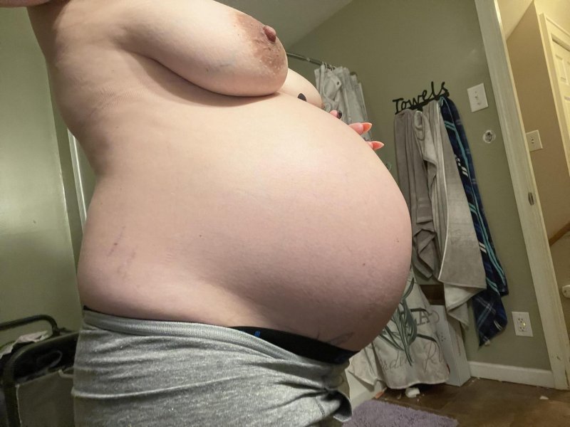 A pregnant woman with big belly, Pregnant with a huge belly, Huge belly of pregnant women