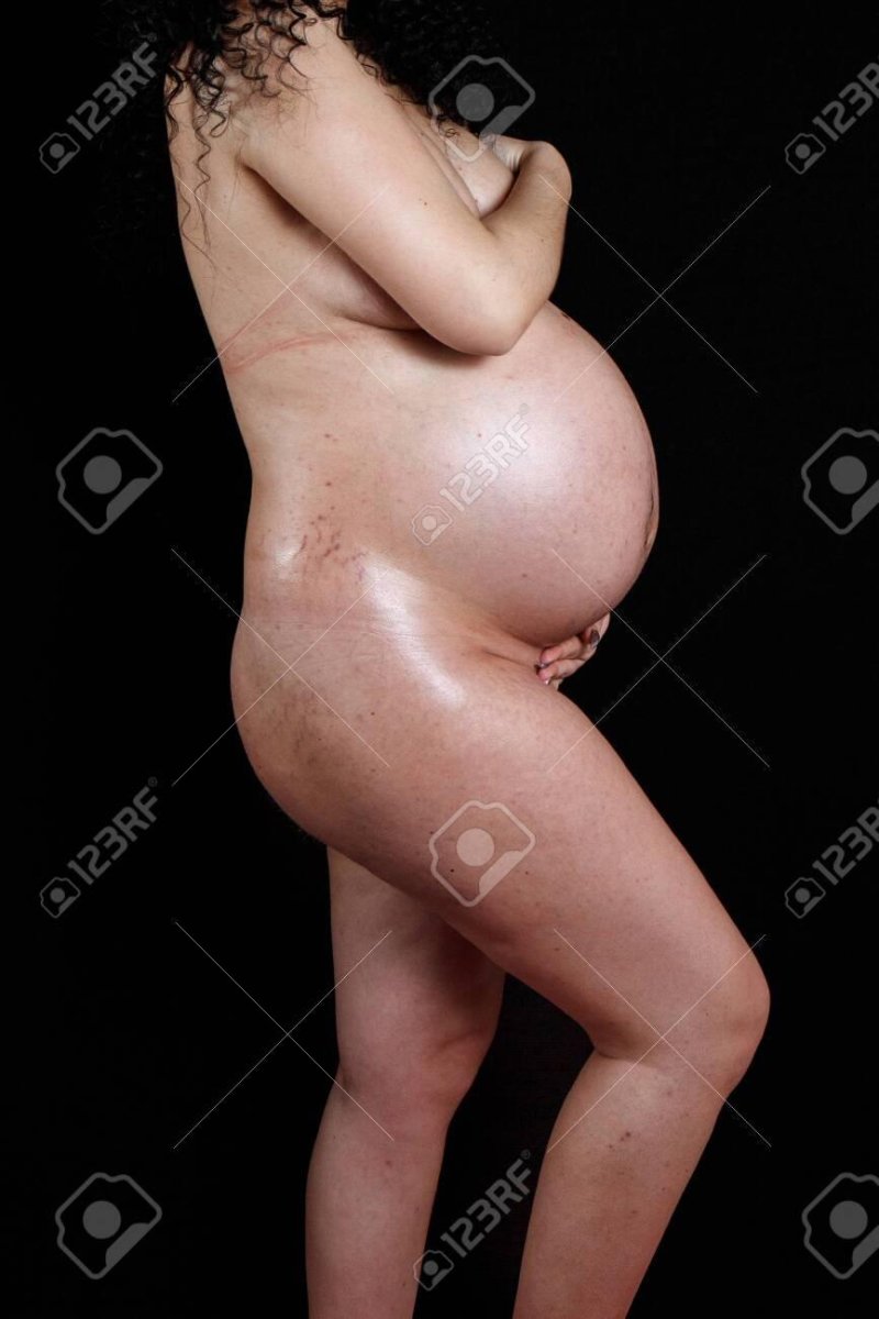 The stomach of a pregnant woman, A pregnant woman, Pregnant woman stomach