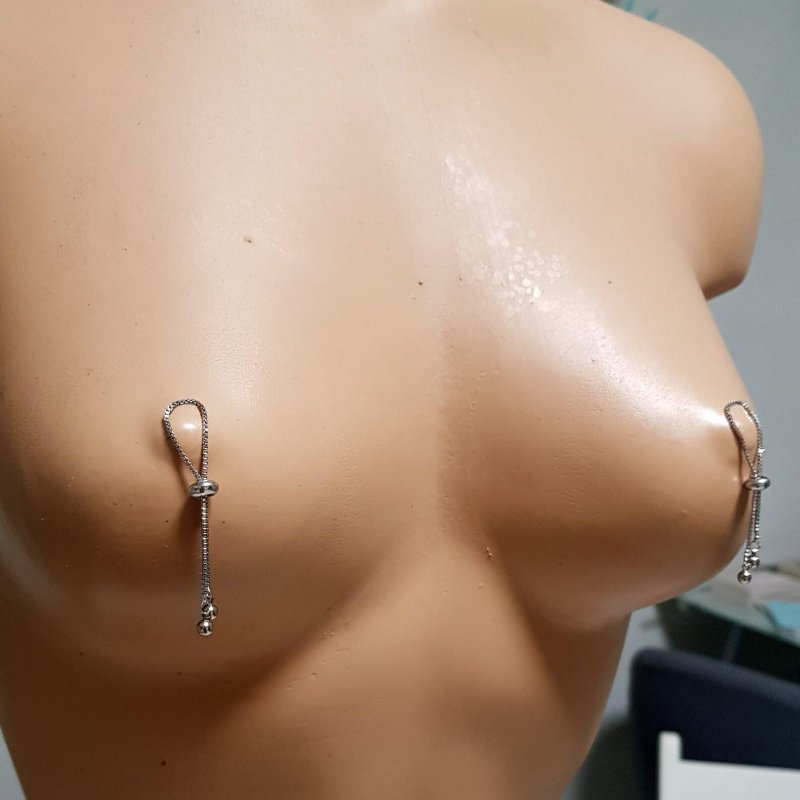 Piercing nipples with a chain, Nipples piercing, The clamp of nipples